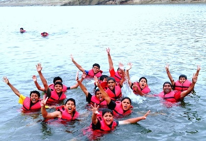 CHILDREN SWIMMING IN A WATER SPORT EVENT AT PONG DAM