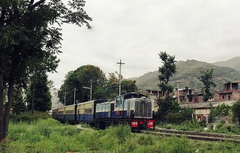 TRAIN ON NARROW GAUGE RAIL TRACK NEAR JOGINDERNAGER
